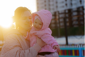Mother embraces child at sunset in, a Nature Photo by darksoul72