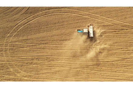 4K Aerial View Tractor With Seed, an Industrial Photo by Our Amazing World