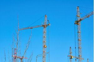 Cranes are lifting materials at a, an Industrial Photo by darksoul72