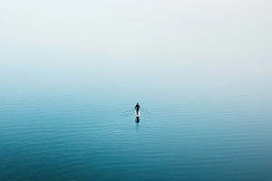 Solitude on calm waters at dawn, a Photo by Beautiful things