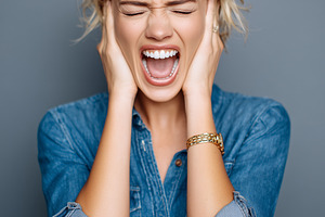 Stressed young woman covering ears, a Person Photo by MistyDay