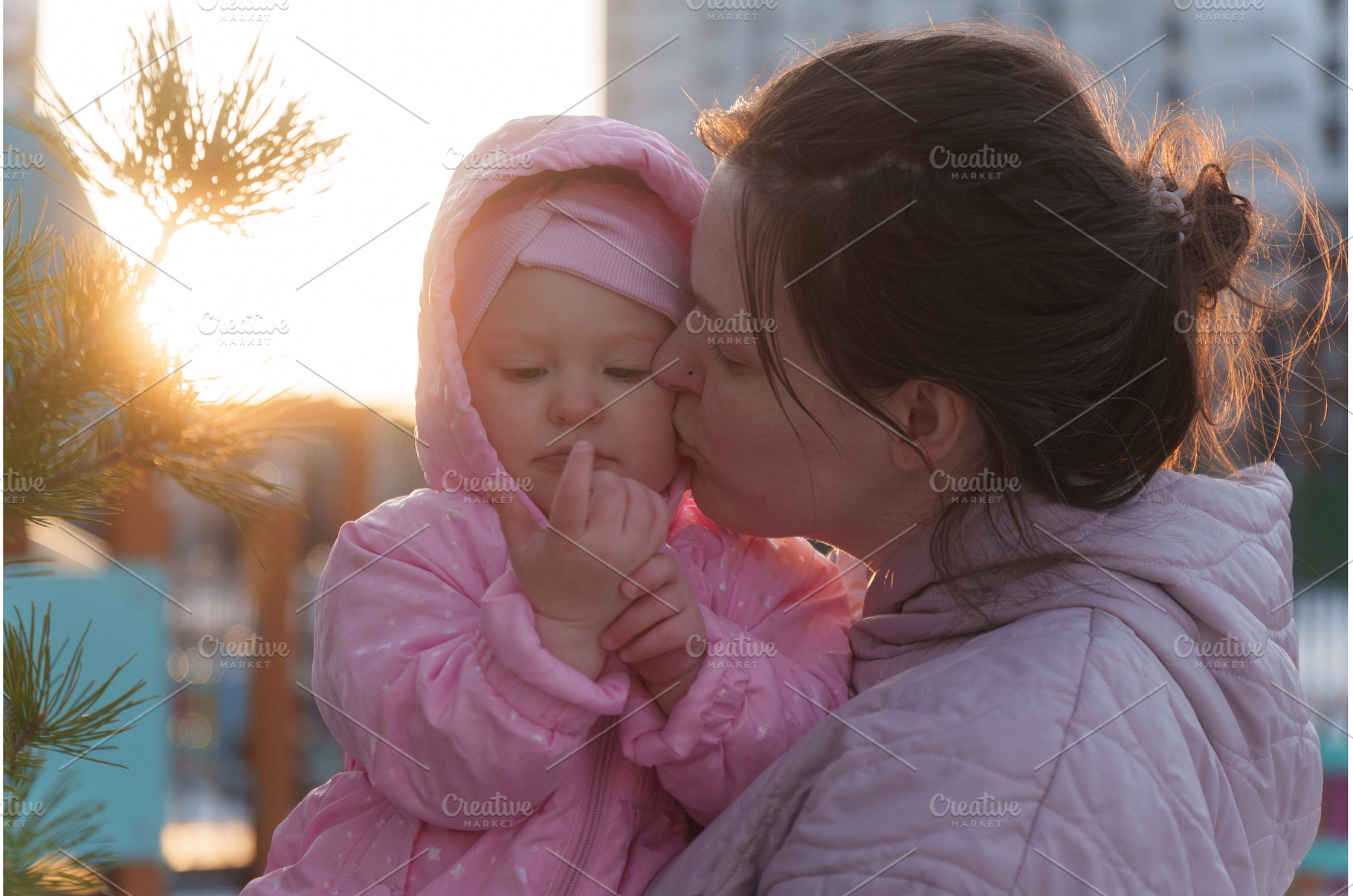Mother kisses daughter in cozy, a Nature Photo by darksoul72