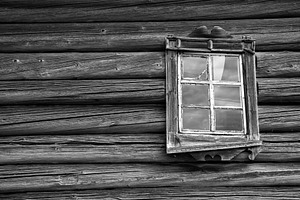 Weathered wooden wall and old window