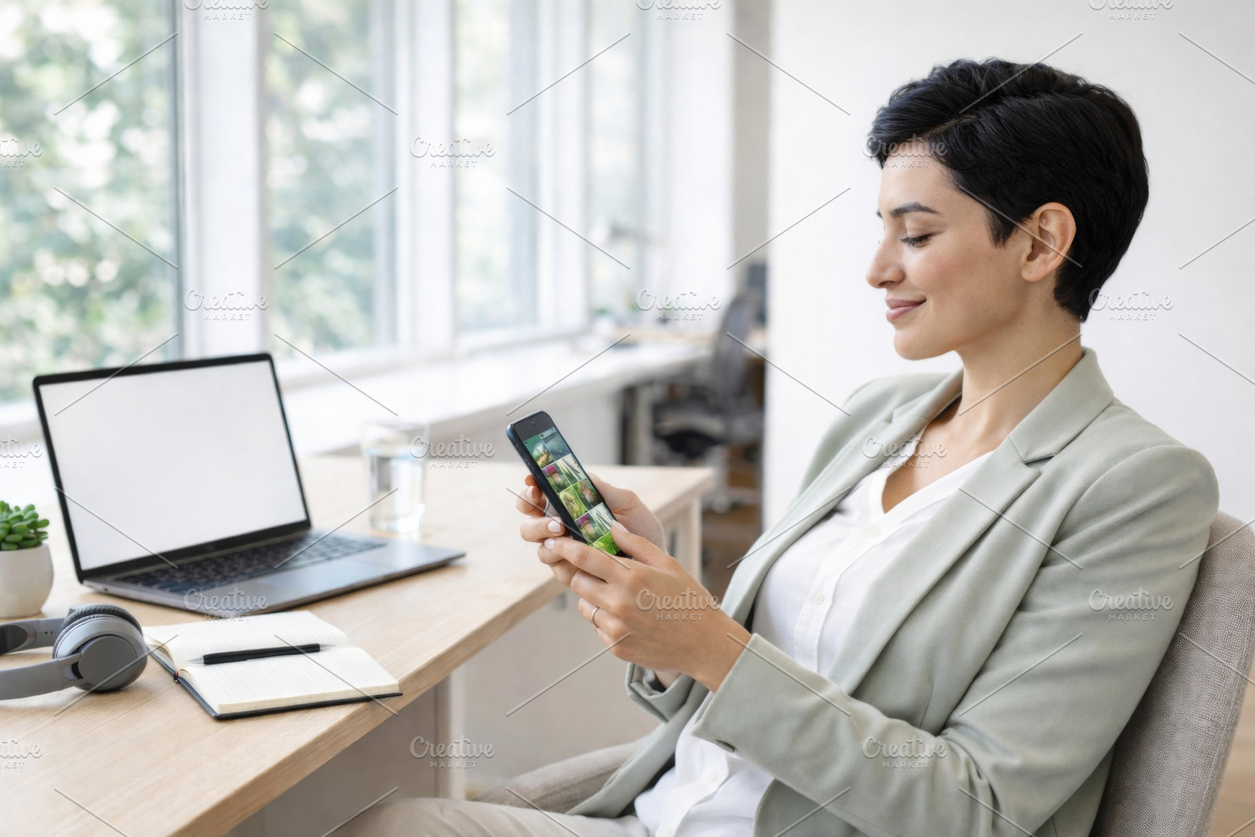 Woman smiling while scrolling on sma, a Photo by Dvoevnore photos