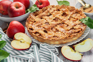 Delicious homemade apple pie showing baking ingredients on rusti, a Food & Drink Photo by Olena Rudo