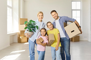 Family Arriving with Plant and Box