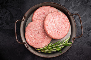 Freshly formed raw meat patty with herbs for burgers, perfect fo, a Food & Drink Photo by composter-box@mail.ru
