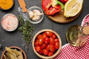 Fresh vegetables and spices with cherry tomatoes, garlic, lemon,, a Food & Drink Photo by ndanko