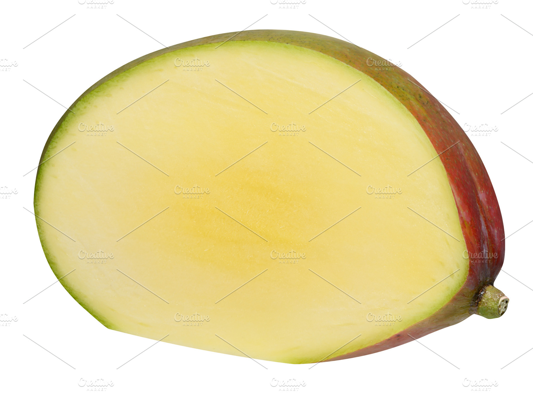 Half of a ripe mango on an isolated background, a Food & Drink Photo by ndanko