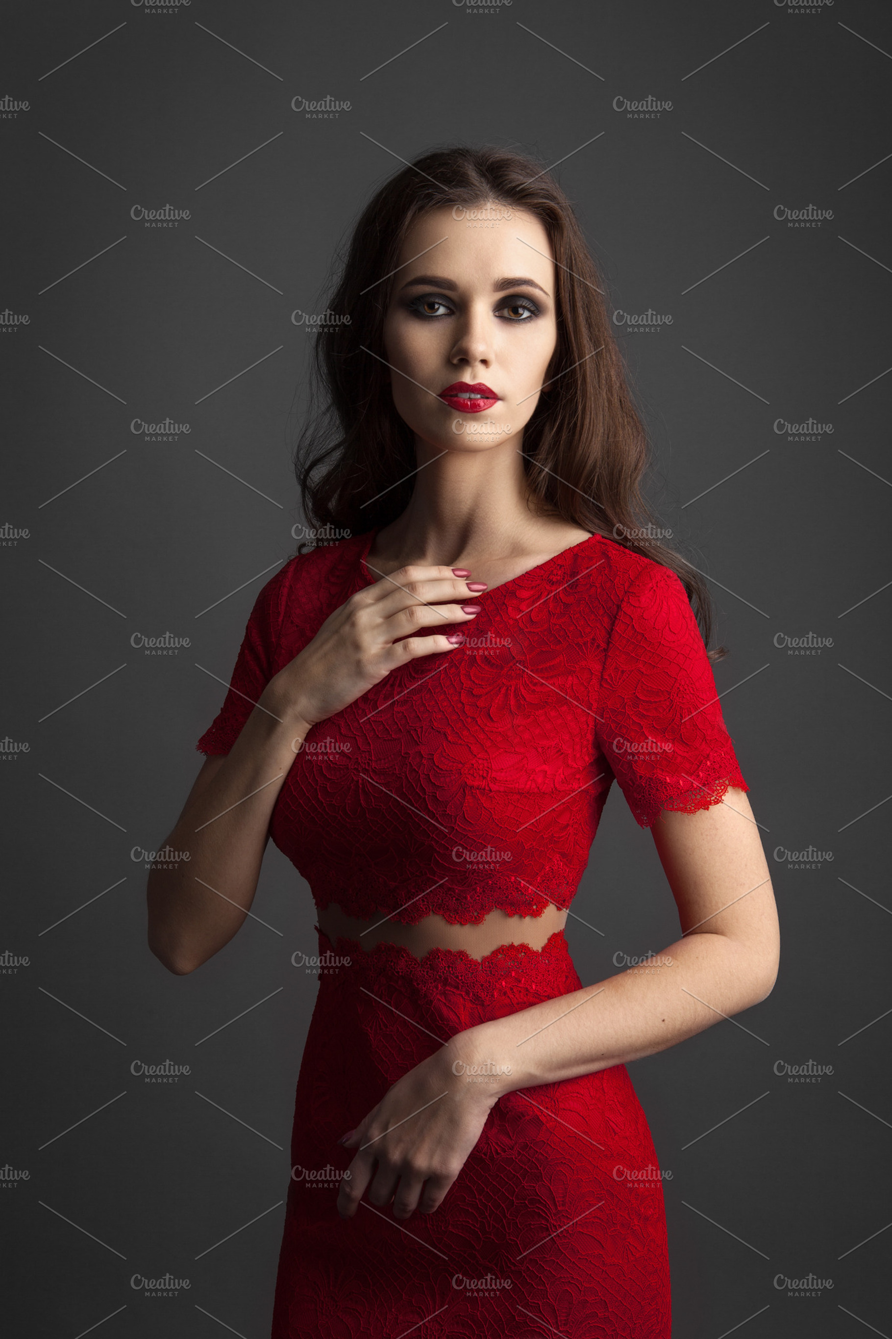 Pretty young sexy model female with dark hair in amazing red dress stock, a Person Photo by sport&beauty stock photo