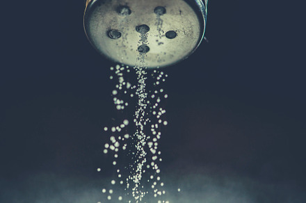Salt shaker on pile of salt featuring salt, adding, and hand