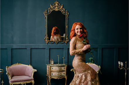 Young woman in luxurious dress stock photo containing woman and redhair, a Beauty & Fashion Photo by Maksym Zaitsev