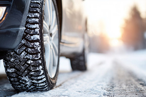 Car with winter tires drives on snow, a Photo by MistyDay