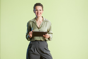 Smiling professional with tablet, a Person Photo by Alliance Images