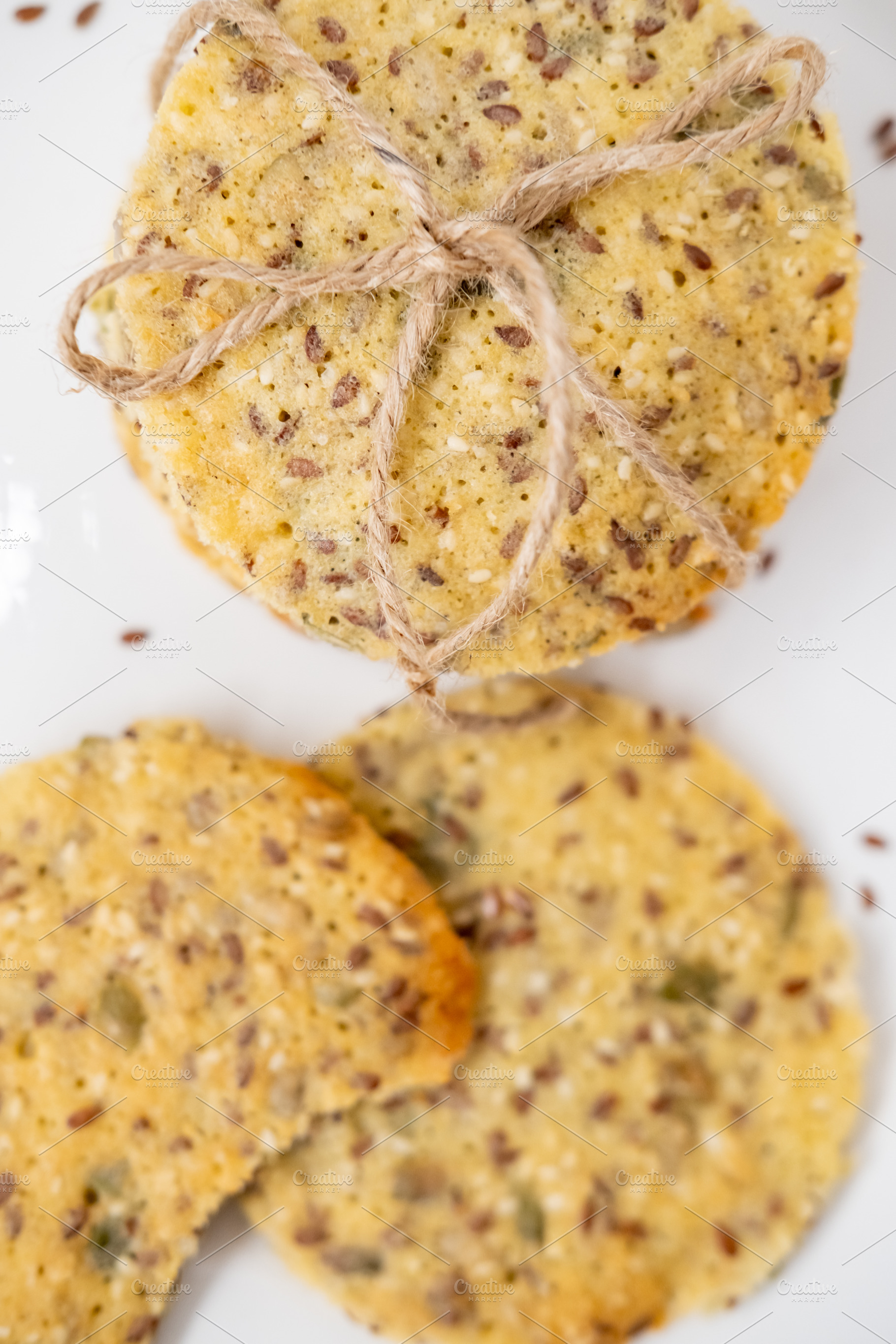 Healthy food grain pastry crackers stack jute flax, a Food & Drink Photo by Photo Drive Studio