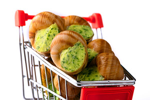 Gourmet escargot with herb butter displayed in a miniature red s, a Food & Drink Photo by Ales Munt