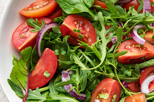 Healthy fresh garden salad with cherry tomatoes, a Food & Drink Photo by Olena Rudo