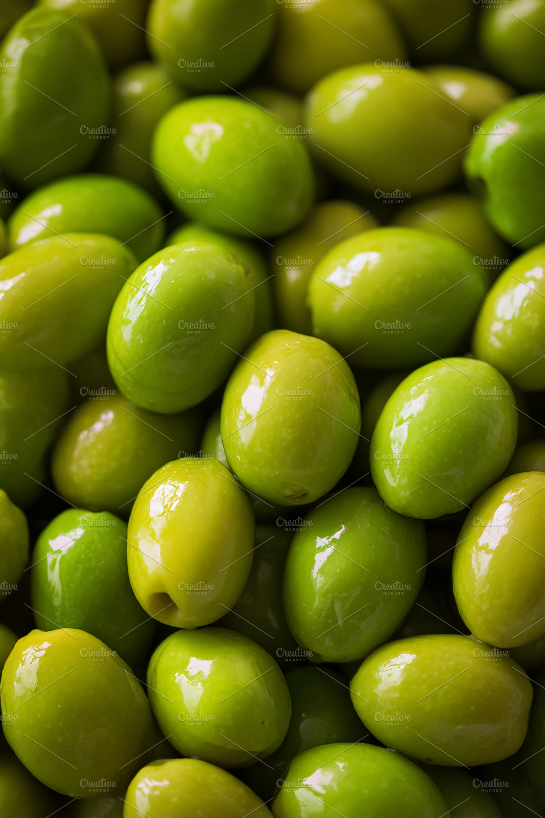 Fresh green olives background showing healthy Mediterranean diet, a Photo by Studio ANNA