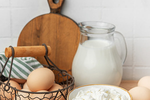 Fresh raw dairy products preparing healthy breakfast, a Food & Drink Photo by Olena Rudo