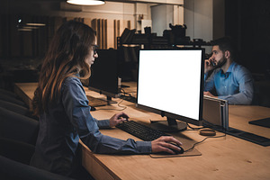 Colleagues working late in office stock photo containing office and work