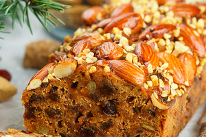 Traditional christmas fruitcake containing christmas, fir, and almonds