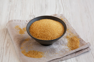 Organic Demerara Sugar in a Bowl, side view., a Food & Drink Photo by LiudmylaChuhunova