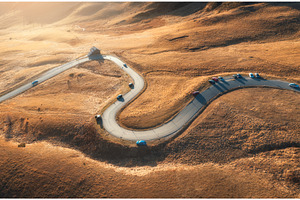 Aerial view of winding road in, a Transportation Photo by den-belitsky