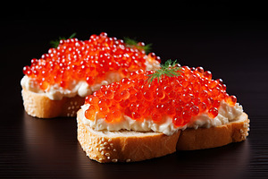 Bread with fresh red caviar on wooden background, a Food & Drink Photo by AlyaAnd