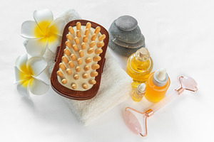 Spa wellness treatment with massage oil and stones, a Beauty & Fashion Photo by Olena Rudo