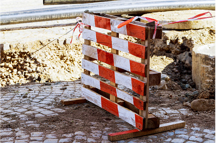 Road closed caution sign on highway, an Industrial Photo by Ungvar Studio