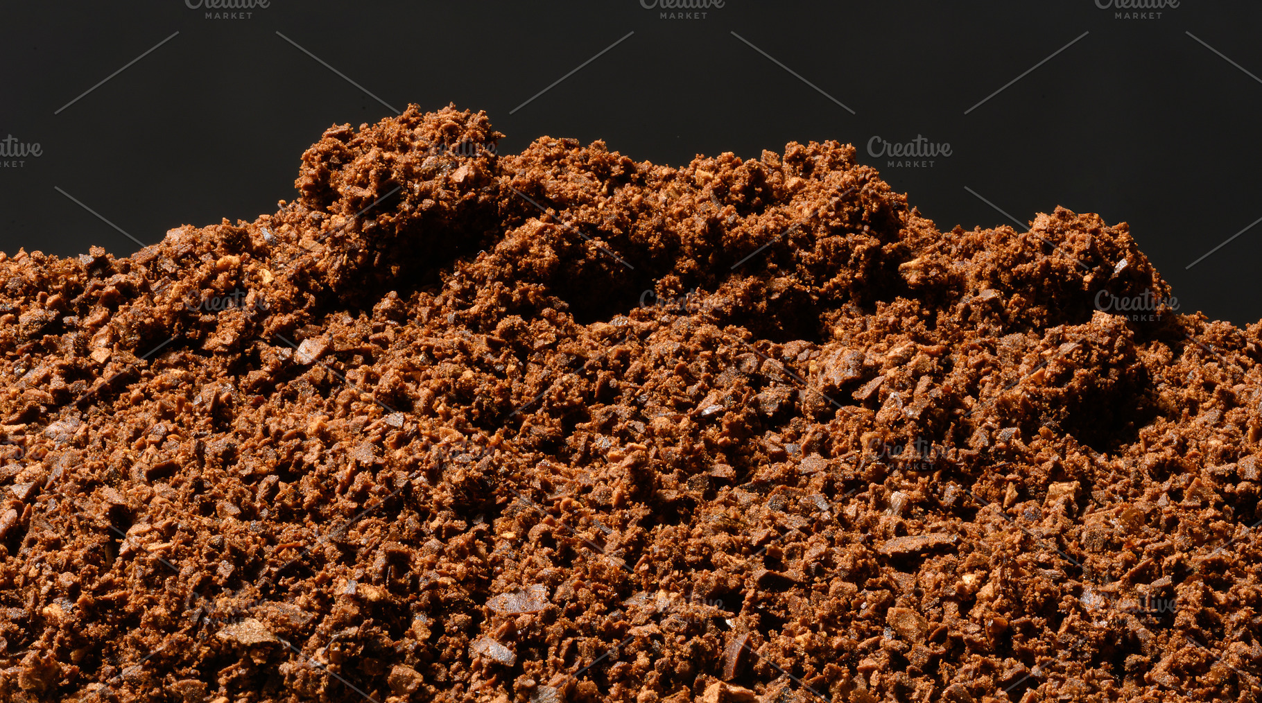 A mountain of freshly ground coarse coffee with pronounced parti, a Food & Drink Photo by ndanko