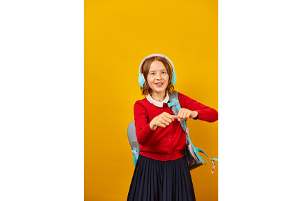 Happy schoolgirl with backpack, a Person Photo by IlliaBondarPhotography