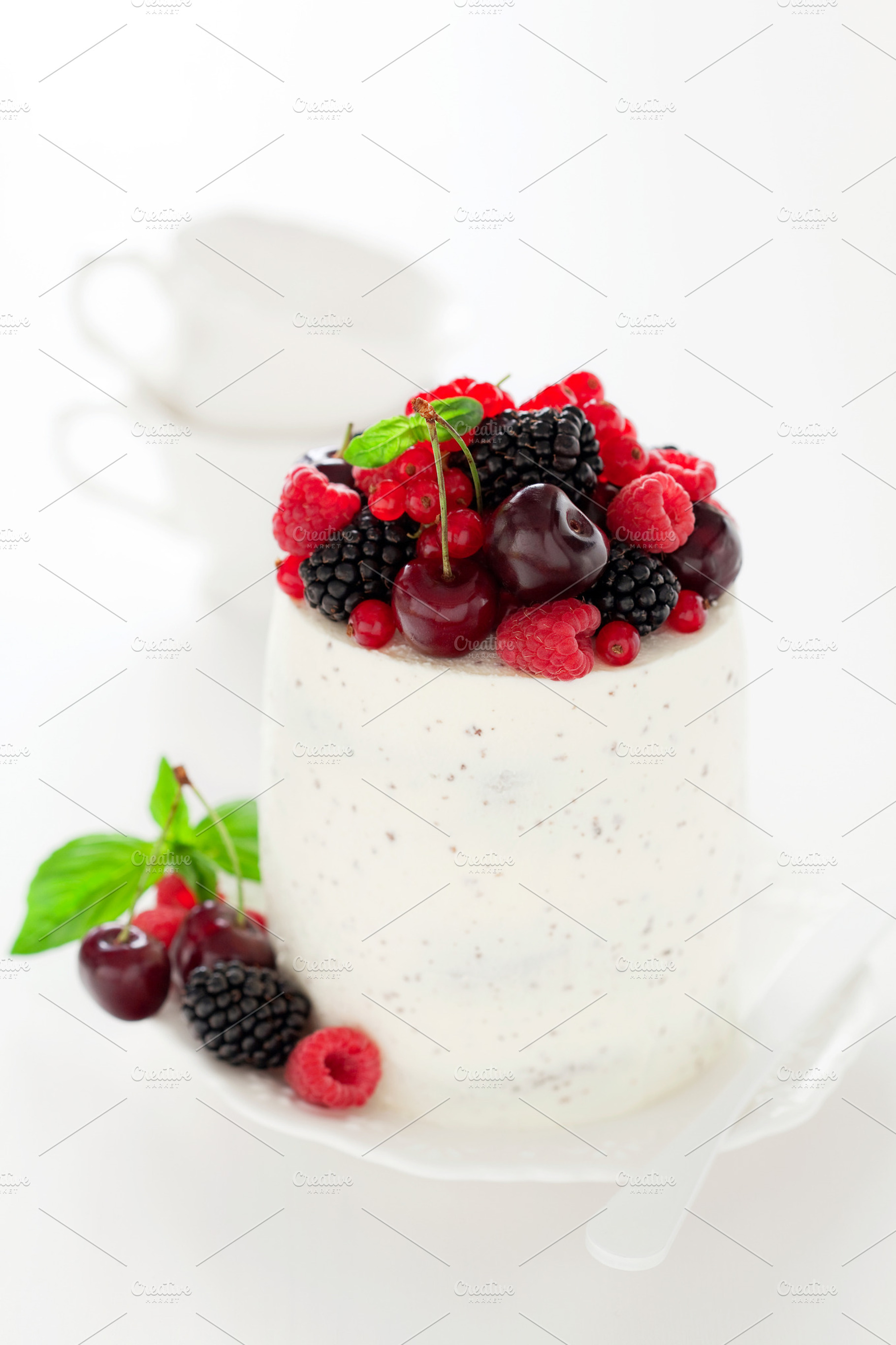 Cake containing berry, cake, and cherry