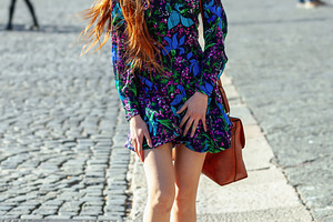 Redhead model lowering her dress lifted by wind in city center, an Abstract Photo by Antonio Gravante Market