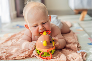 Little baby playing with toys on a, a School & Education Photo by Elizaveta Galitskaya