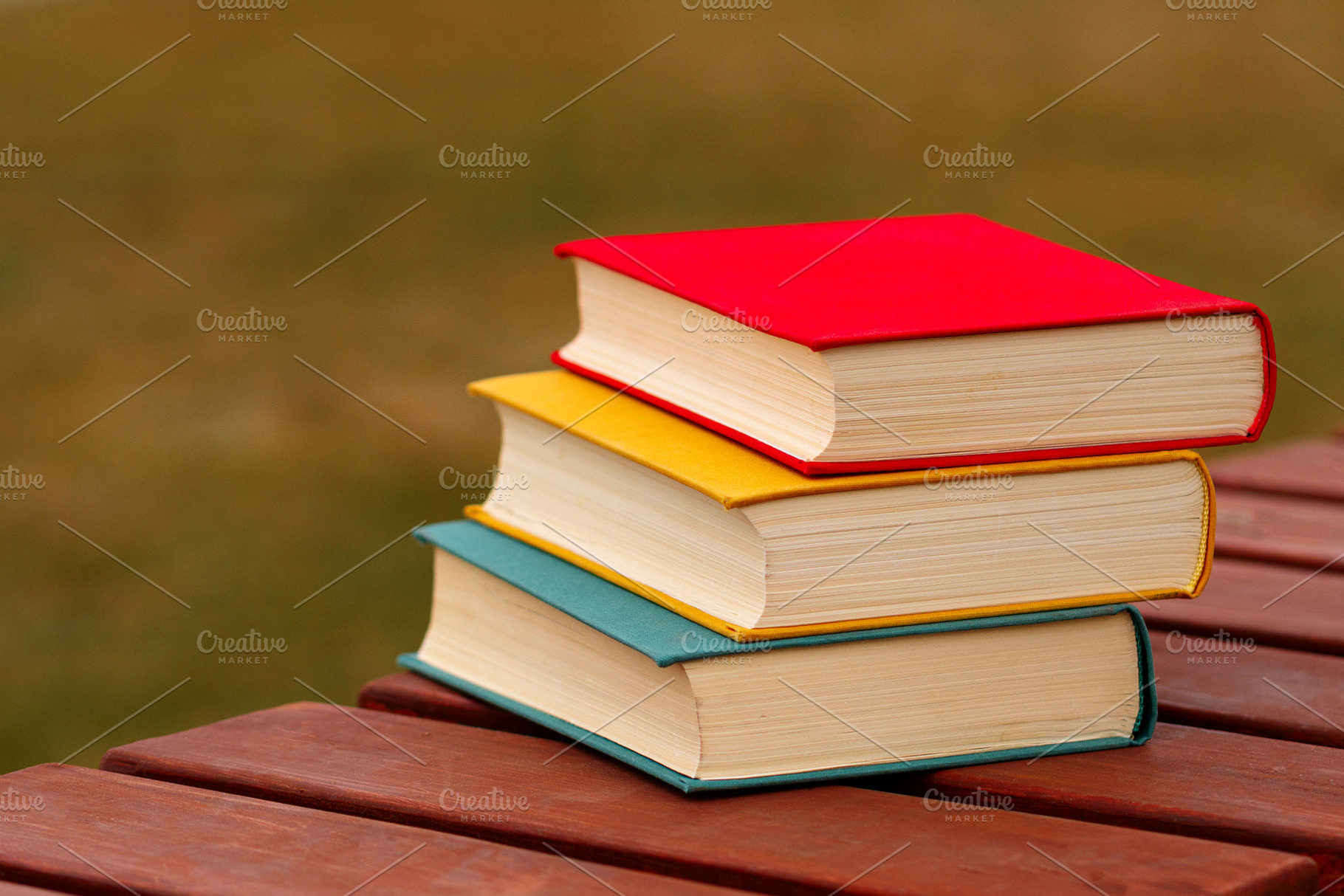 Close-up of three hardcover books, a School & Education Photo by Elena Vagengeim