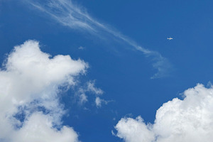 Airplane on blue sky and cloud, a Nature Photo by ArtBackground