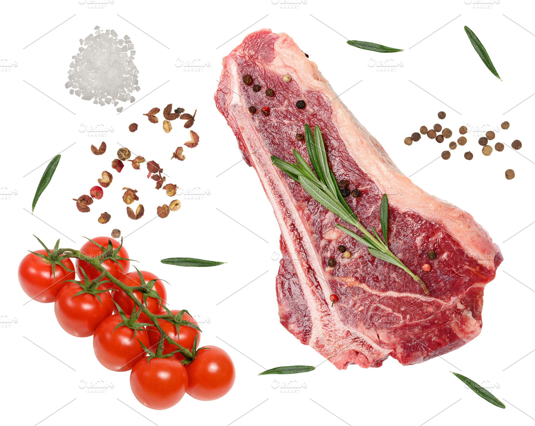A raw bone-in steak with pepper and rosemary, a vine of ripe che, a Food & Drink Photo by ndanko