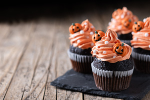 Halloween cupcakes with Halloween sprinkles on wooden table, a Food & Drink Photo by etorres69
