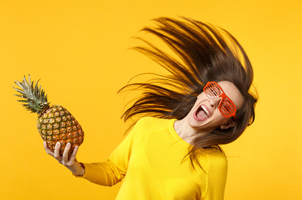 Cheerful young woman in funny glasse stock photo containing background and