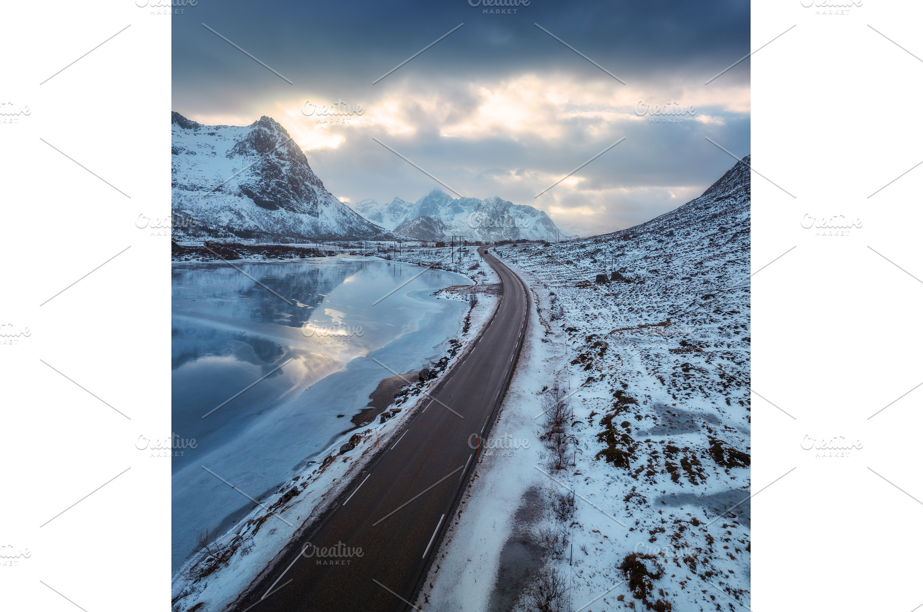 Aerial view of winter road at sunset, a Nature Photo by den-belitsky