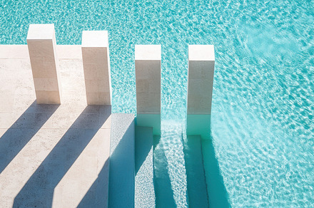 Tranquil pool steps under sunlight, a Photo by Beautiful things