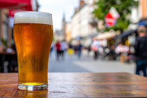 pint of beer in a pub AI generated, a Photo by WorldOfPhotos