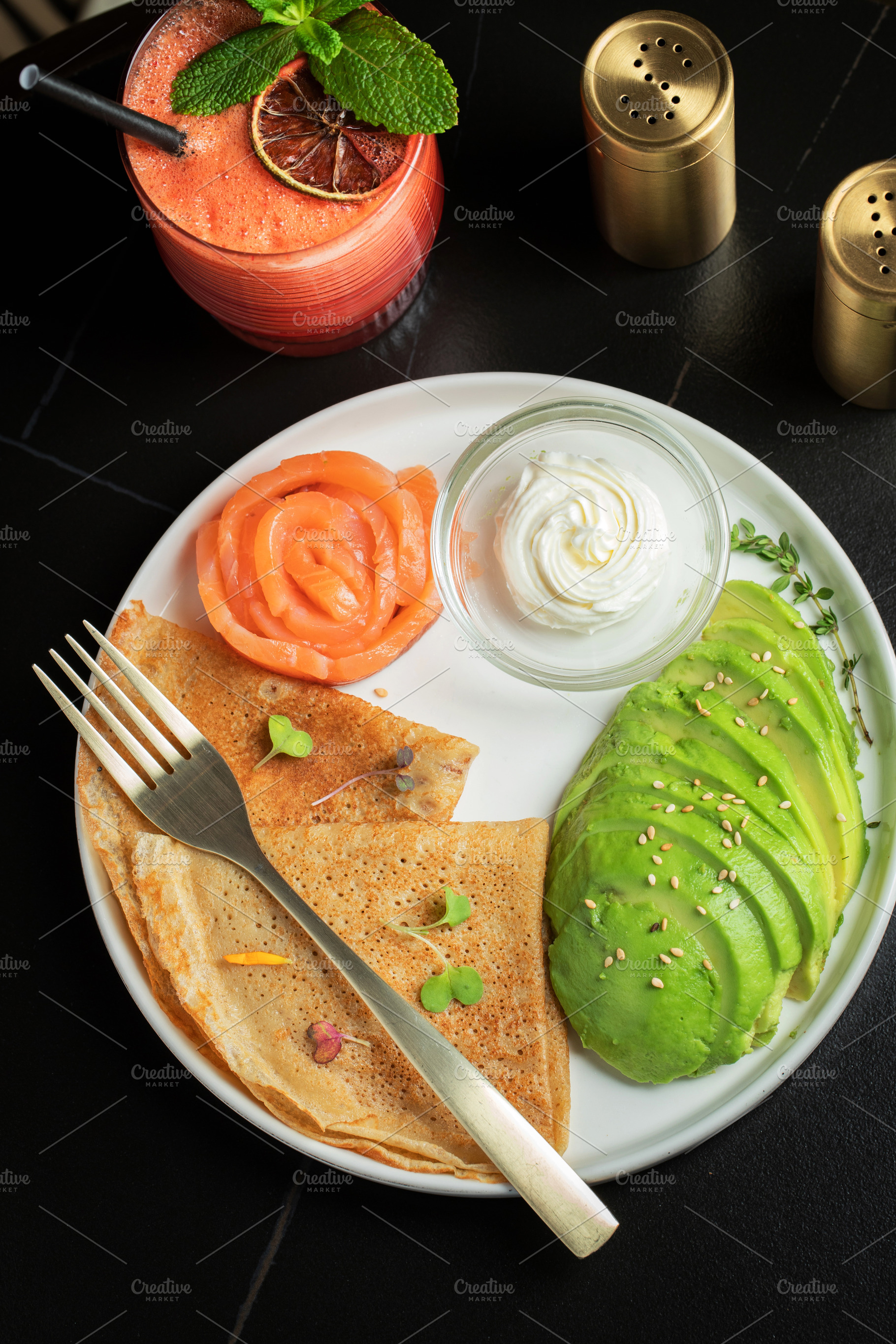 Roasted thin pancakes with smoked salmon and sauce, a Food & Drink Photo by Budarinphoto