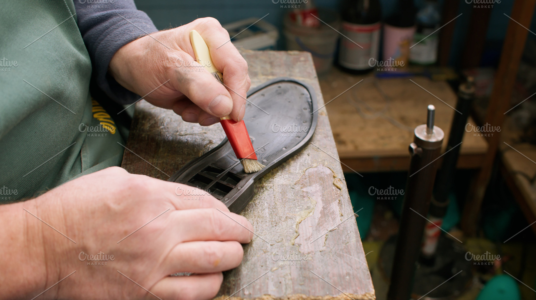 Shoemaker working cobbler workshop glue sole brush, a Person Photo by Photo Drive Studio