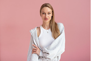 Young woman poses in gray loungewear, a Person Photo by undrey