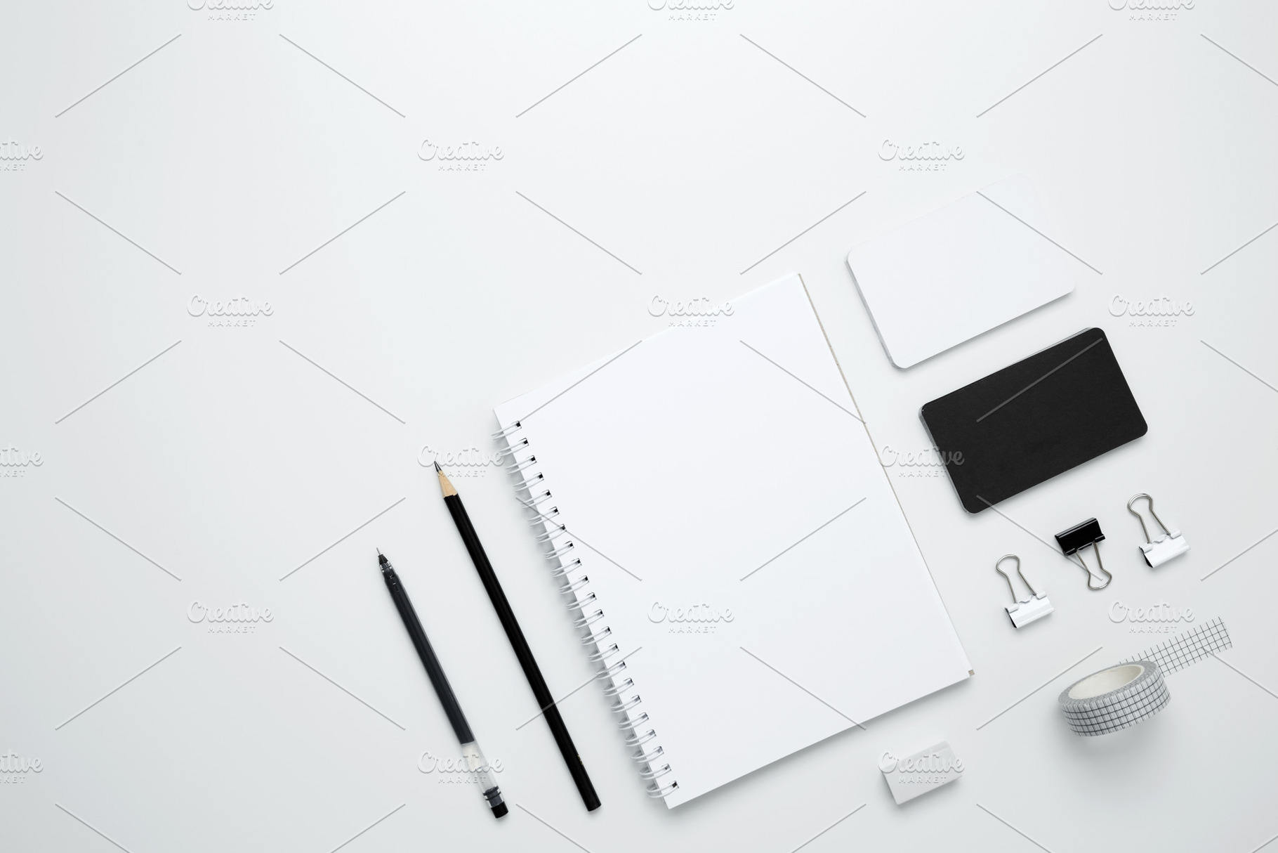 On a white background, an empty mock up notebook, white and black cards, monoch, a Photo by matucha