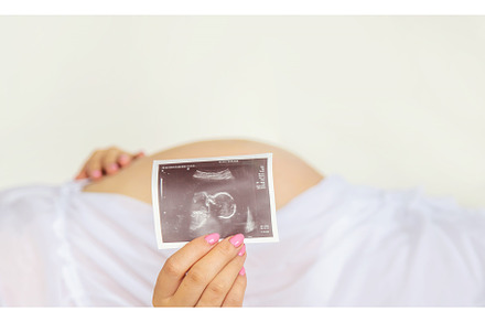Pregnant woman with girl ultrasound, a Person Photo by yanadjana