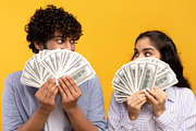 Big win concept. Young indian couple holding and covering faces with a lot of d, a Photo by Prostock-Studio (Thumbnail 2 of 4)