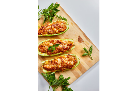 Stuffed zucchini on white background, a Food & Drink Photo by IlliaBondarPhotography